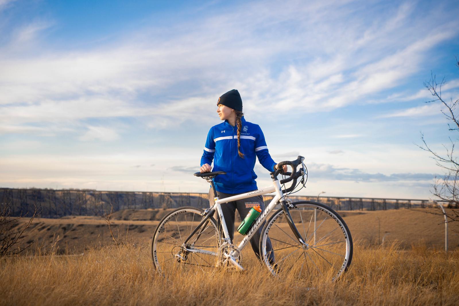 Laura outdoors on her bike